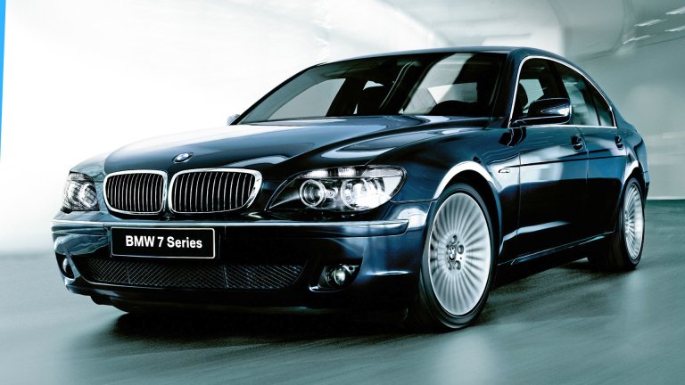 A BMW 760 whooshing through a garage.