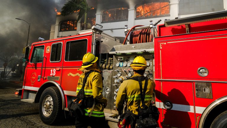 Firefighters attempt to extinguish a Los Angeles building fire.