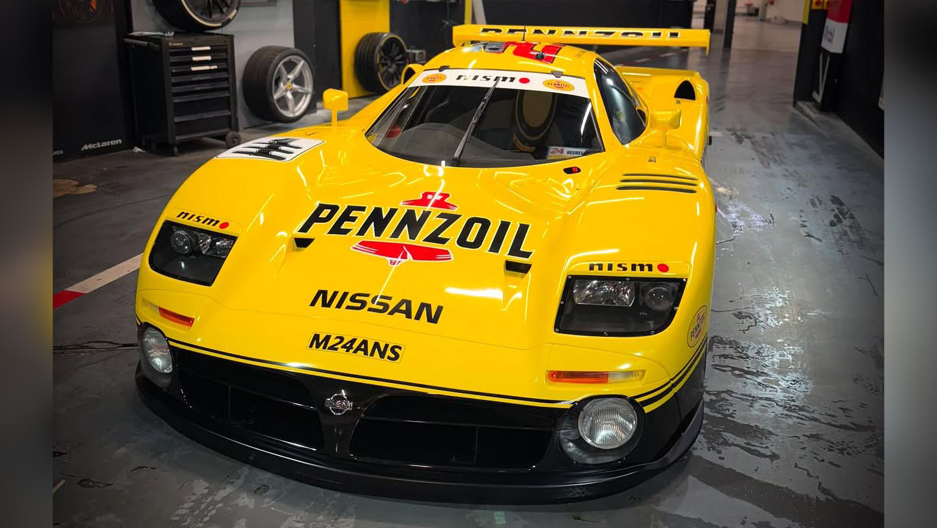 Photo of Erik Comas' Nissan R390 GT1 wrapped in a Pennzoil NISMO GT-R GT500 livery.